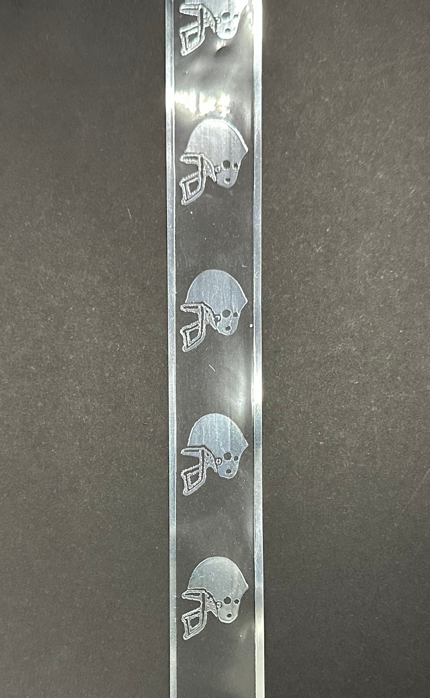 Clear skinny ribbon with silver football helmets - 36 inches