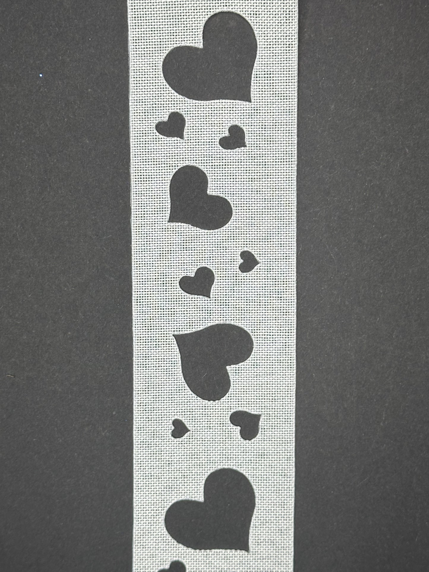 White ribbon with heart cutouts (garter)